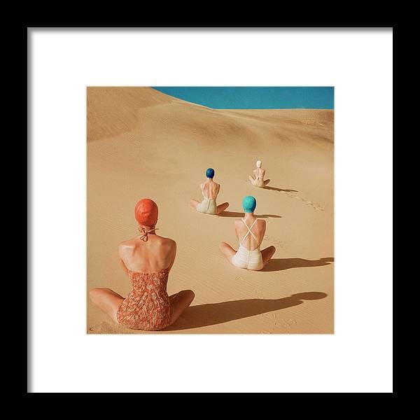 Models Sitting On Sand Dunes Framed Print